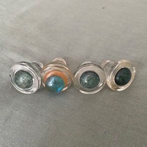 4 handcrafted glass wine stoppers.